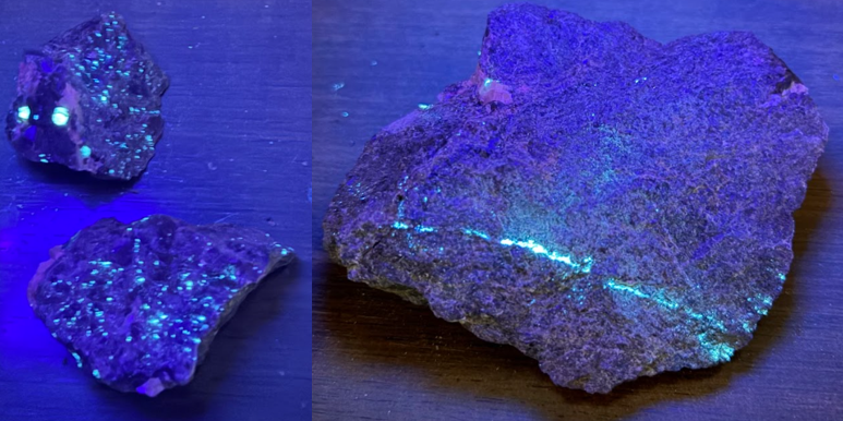 The image shows a piece of crystalized mineral with a blue glow, contrasting against a dark, rough rock surface.

AI-generated content may be incorrect.
